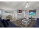 Open-concept living area connecting the living room, dining area, and kitchen for easy flow at 12760 Indian Rocks Rd # 578, Largo, FL 33774