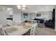 Open living space with dining area and living room, with natural light and ceiling fans at 12760 Indian Rocks Rd # 578, Largo, FL 33774