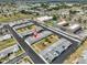 Aerial view of community featuring well-maintained landscaping, ample parking, and convenient access to major thoroughfares at 1304 Burbank Ct, Sun City Center, FL 33573