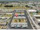 Aerial view of the property featuring community landscape, parking, and proximity to roads at 1304 Burbank Ct, Sun City Center, FL 33573