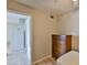 Bedroom with laminate flooring and a view to the kitchen at 1304 Burbank Ct, Sun City Center, FL 33573