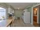 Functional kitchen featuring modern appliances, ample counter space and bright natural light with access to the patio at 1304 Burbank Ct, Sun City Center, FL 33573