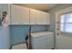 Laundry room with storage cabinets at 1304 Burbank Ct, Sun City Center, FL 33573