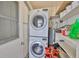 Bright laundry room equipped with a washer and dryer at 1304 Burbank Ct, Sun City Center, FL 33573