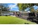Spacious backyard with gazebo, patio furniture, green lawn and privacy fence at 1357 S Betty Ln, Clearwater, FL 33756