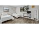 Bright bedroom features two twin beds and modern floors at 1357 S Betty Ln, Clearwater, FL 33756