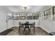 Inviting dining room with natural light, neutral decor, and a modern light fixture at 1357 S Betty Ln, Clearwater, FL 33756