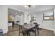 Stylish dining room with modern table and seating, wood floors, and doorway to living area at 1357 S Betty Ln, Clearwater, FL 33756
