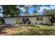 Beautifully landscaped front yard with a single-story home showcasing classic curb appeal at 1357 S Betty Ln, Clearwater, FL 33756