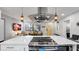Modern kitchen featuring stainless steel appliances and seamless flow into the living area at 1357 S Betty Ln, Clearwater, FL 33756