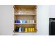 Kitchen cabinet with various drinking glasses and mugs neatly arranged on shelves at 1357 S Betty Ln, Clearwater, FL 33756
