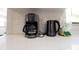 Modern kitchen counter featuring a coffee maker and electric kettle at 1357 S Betty Ln, Clearwater, FL 33756