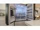 Modern refrigerator with custom shelving and a water filter, complemented by bright interior lighting at 1357 S Betty Ln, Clearwater, FL 33756