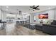 Open-concept living area flowing into a modern kitchen, with sleek countertops and bar stool seating at 1357 S Betty Ln, Clearwater, FL 33756