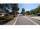 View of the neighborhood street with mature trees and well-maintained homes, showcasing a peaceful residential area at 1357 S Betty Ln, Clearwater, FL 33756