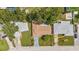 Home with a well-manicured lawn, mature trees, long driveway, and a nice roof at 1453 62Nd S Ter, St Petersburg, FL 33705