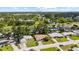 An aerial view of the property showing the backyard and the nearby lake and wooded areas at 1453 62Nd S Ter, St Petersburg, FL 33705