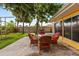 Backyard featuring a patio, outdoor seating, and mature trees at 1453 62Nd S Ter, St Petersburg, FL 33705