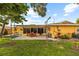 Lush backyard featuring an outdoor patio and well-manicured lawn at 1453 62Nd S Ter, St Petersburg, FL 33705