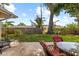 Backyard patio area featuring comfortable seating and mature landscaping at 1453 62Nd S Ter, St Petersburg, FL 33705