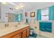 Bright bathroom with a vanity, large mirror, and coordinated fixtures at 1453 62Nd S Ter, St Petersburg, FL 33705