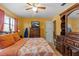 Well-appointed bedroom features a dresser and warm natural lighting at 1453 62Nd S Ter, St Petersburg, FL 33705