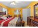 Comfortable bedroom with a bed, warm lighting, and storage at 1453 62Nd S Ter, St Petersburg, FL 33705