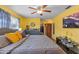 Comfortable bedroom featuring a ceiling fan, wood flooring and a walk-in closet at 1453 62Nd S Ter, St Petersburg, FL 33705