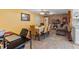 Dining room featuring a long table and a brick wall with a fireplace at 1453 62Nd S Ter, St Petersburg, FL 33705