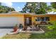 Well-maintained home with an attached garage, mature landscaping and a decorative stone garden at 1453 62Nd S Ter, St Petersburg, FL 33705
