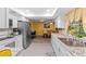 Kitchen with white cabinets, stainless appliances and granite countertops at 1453 62Nd S Ter, St Petersburg, FL 33705