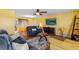 Bright living room with large windows, ceiling fan, stylish furniture and modern decor at 1453 62Nd S Ter, St Petersburg, FL 33705