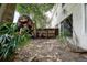 View of the backyard with wood fence and plants near the rear of the house at 14985 Alan Ct, Largo, FL 33771
