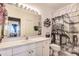 Bathroom with a large vanity, tiled flooring and a shower/tub combo at 14985 Alan Ct, Largo, FL 33771