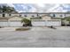Street view of three townhouses, each with a two-car garage at 14985 Alan Ct, Largo, FL 33771