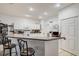 Kitchen featuring white cabinets and countertops with a breakfast bar area at 14985 Alan Ct, Largo, FL 33771