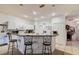 The kitchen area has white cabinets and a breakfast bar with barstool seating at 14985 Alan Ct, Largo, FL 33771