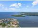 An aerial view showing waterfront access, a canal, a river, and a nature preserve at 150 Carlyle Dr, Palm Harbor, FL 34683