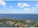 Beautiful aerial view of a waterfront home on a canal at 150 Carlyle Dr, Palm Harbor, FL 34683