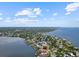 Beautiful aerial view of a waterfront home on a canal at 150 Carlyle Dr, Palm Harbor, FL 34683