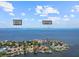 An aerial view showing nearby beaches, waterfront location, and surrounding areas at 150 Carlyle Dr, Palm Harbor, FL 34683