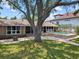 A backyard featuring a swimming pool, patio, and fire pit area for outdoor enjoyment at 150 Carlyle Dr, Palm Harbor, FL 34683