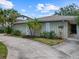 Charming home exterior featuring a well-kept lawn and meticulous landscaping at 150 Carlyle Dr, Palm Harbor, FL 34683