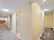 This is a hallway with views of rooms on either side of the hallway at 150 Carlyle Dr, Palm Harbor, FL 34683
