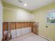 Partially renovated laundry room features plumbing, window, and electrical outlets ready for finishing touches at 150 Carlyle Dr, Palm Harbor, FL 34683