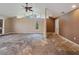 Open living room space ready for renovation, featuring ample natural light at 150 Carlyle Dr, Palm Harbor, FL 34683