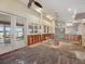 Open-concept living area with french doors and large windows offering lake views, ready for new design at 150 Carlyle Dr, Palm Harbor, FL 34683