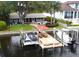 Waterfront property featuring boat lifts, docks, and access to open water, offering a boater's paradise at 150 Carlyle Dr, Palm Harbor, FL 34683