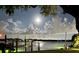 Enjoy the night scene from this waterfront property on the canal at 150 Carlyle Dr, Palm Harbor, FL 34683
