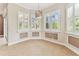 Cozy breakfast nook featuring plantation shutters and decorative pendant lighting at 16101 Cape Coral Dr, Wimauma, FL 33598